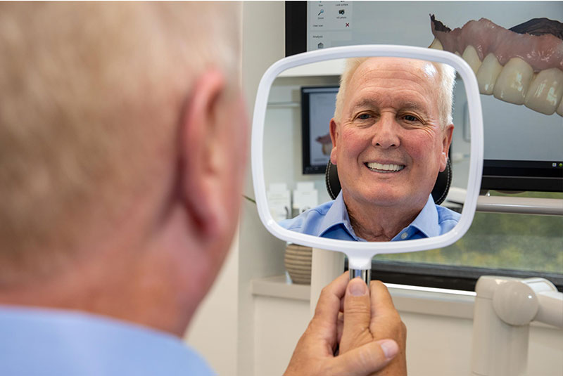 patient smiling confidently after their dental procedure