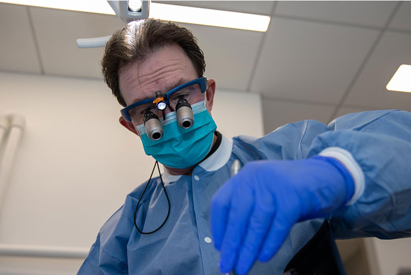 doctor performing dental procedure